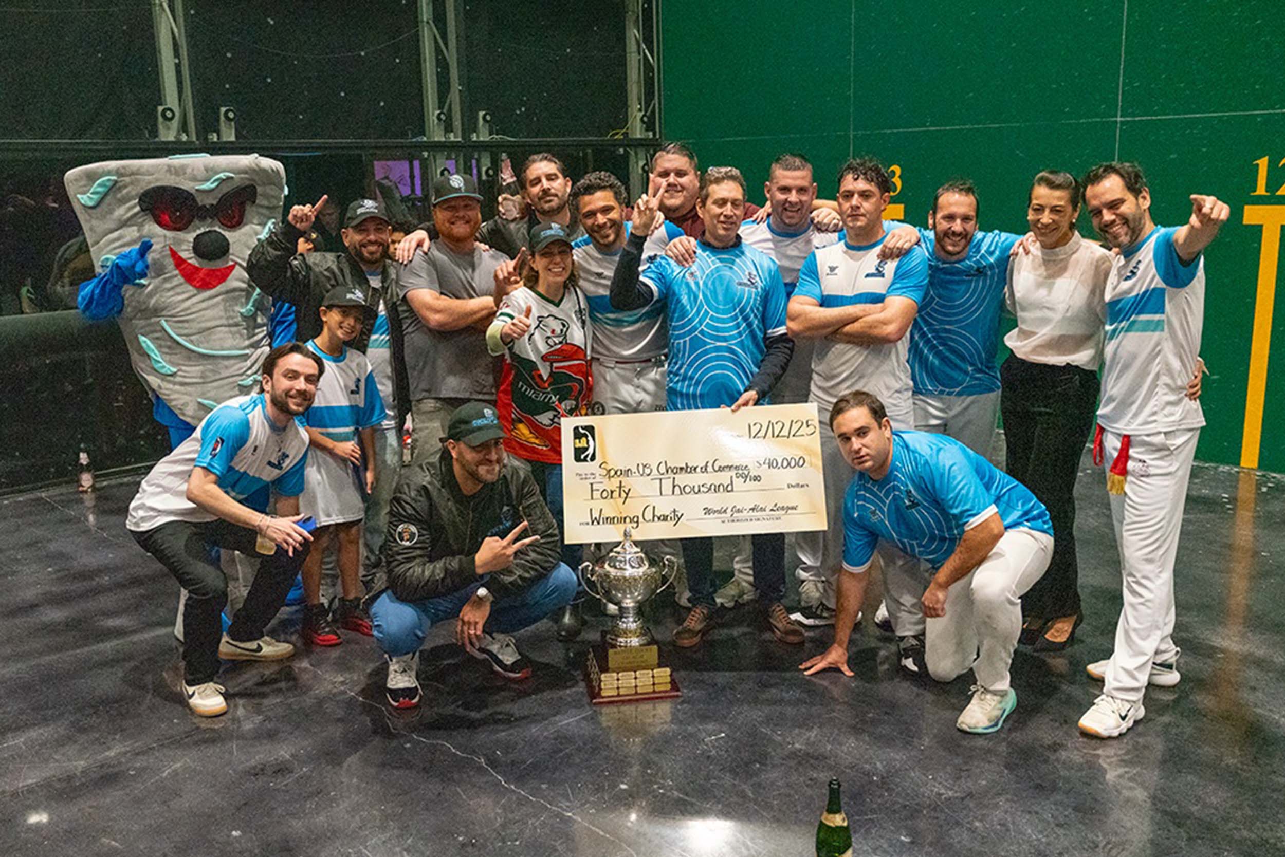 Fall 2025 champions present ceremonial check to Spain-US Chamber of Commerce